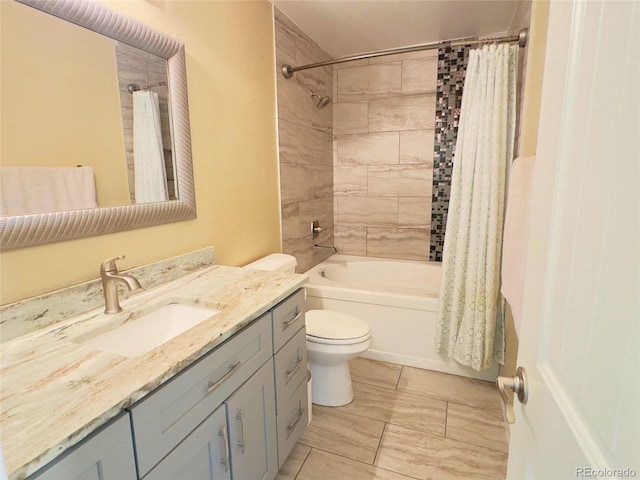 full bathroom with vanity, toilet, and shower / tub combo