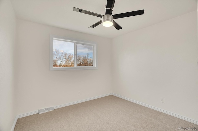 empty room featuring visible vents, baseboards, ceiling fan, and carpet flooring