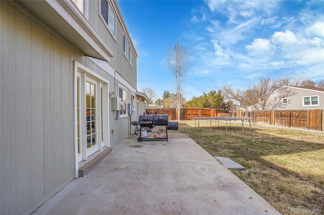 view of patio featuring a fenced backyard and a trampoline