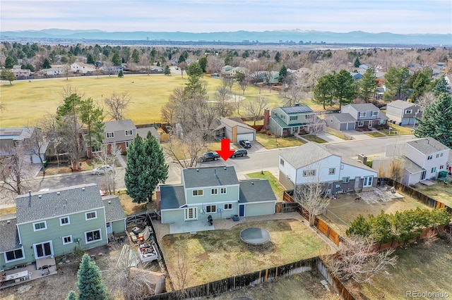 birds eye view of property with a mountain view and a residential view