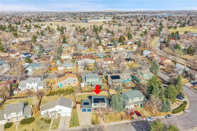 birds eye view of property with a residential view