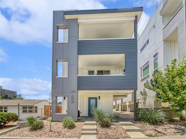 1245 Utica St Unit 104, Denver, CO 80204 - modern home with board and batten siding