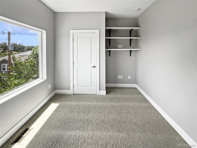 1245 Utica St Unit 104, Denver, CO 80204 - unfurnished bedroom with carpet flooring and baseboards