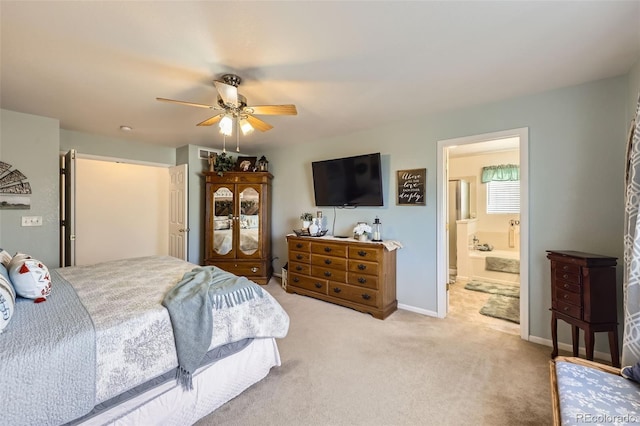 carpeted bedroom featuring ensuite bathroom and ceiling fan