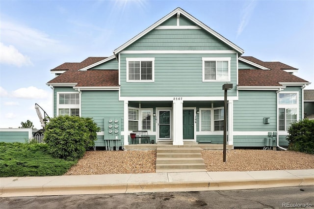 2567 Cutters Cir Unit 101, Castle Rock, CO 80108 - view of front of home with covered porch and a shingled roof
