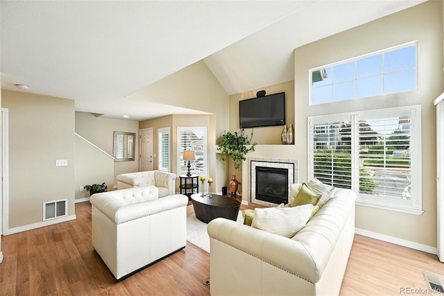 2567 Cutters Cir Unit 101, Castle Rock, CO 80108 - living area with light wood-style floors and a glass covered fireplace