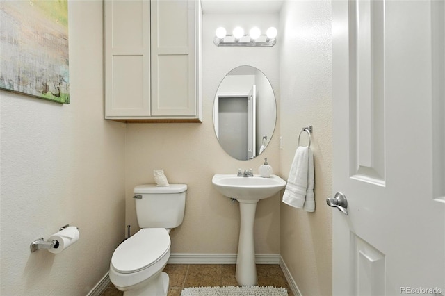 2567 Cutters Cir Unit 101, Castle Rock, CO 80108 - half bath with toilet and tile patterned floors