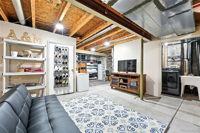 2567 Cutters Cir Unit 101, Castle Rock, CO 80108 - living area featuring washer / dryer and concrete flooring
