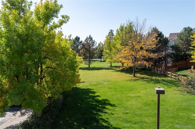 view of home's community featuring a lawn