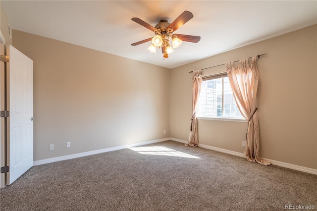 empty room with carpet floors, baseboards, and ceiling fan