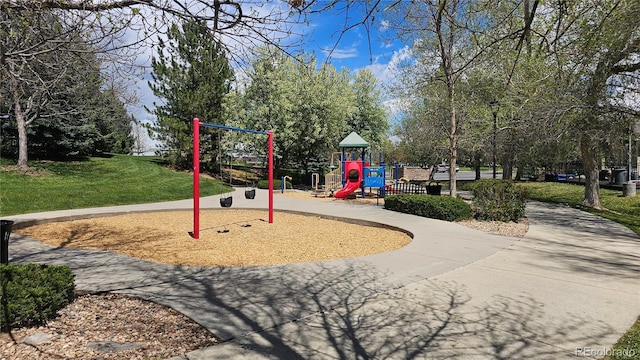 community jungle gym with a yard