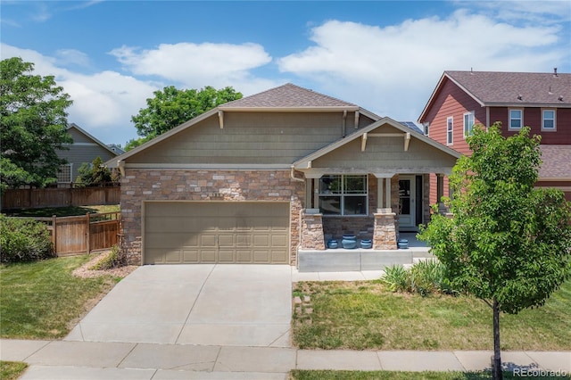 123 Blue Stem St, Brighton, CO 80601 - craftsman inspired home with driveway, a porch, a garage, and stone siding