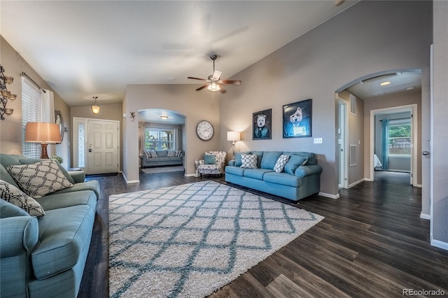 123 Blue Stem St, Brighton, CO 80601 - living room with arched walkways, dark wood-style floors, ceiling fan, and vaulted ceiling