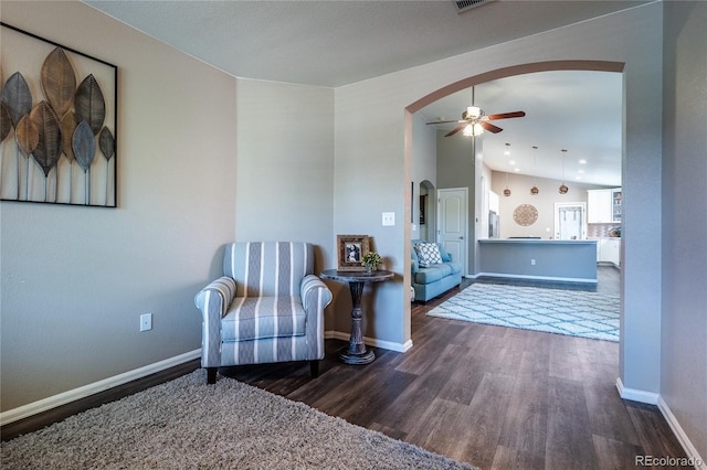 123 Blue Stem St, Brighton, CO 80601 - sitting room with arched walkways, wood finished floors, and ceiling fan