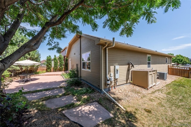 123 Blue Stem St, Brighton, CO 80601 - back of property featuring a fenced backyard and a patio area