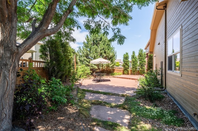 123 Blue Stem St, Brighton, CO 80601 - fenced backyard with a patio area