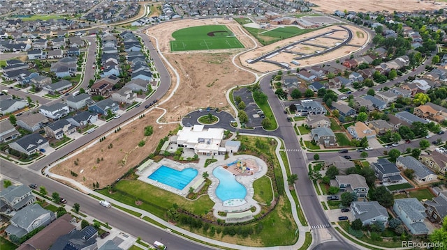 123 Blue Stem St, Brighton, CO 80601 - aerial view of property's location featuring a pool area and nearby suburban area