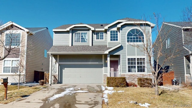 traditional-style home featuring an attached garage, stone siding, a shingled roof, and concrete driveway