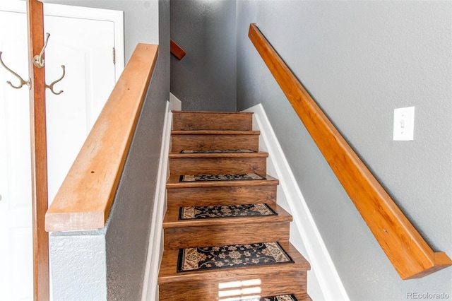 stairs with wood finished floors