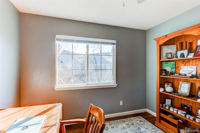 office area featuring baseboards and wood finished floors