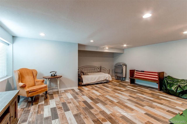 bedroom featuring recessed lighting and wood finished floors