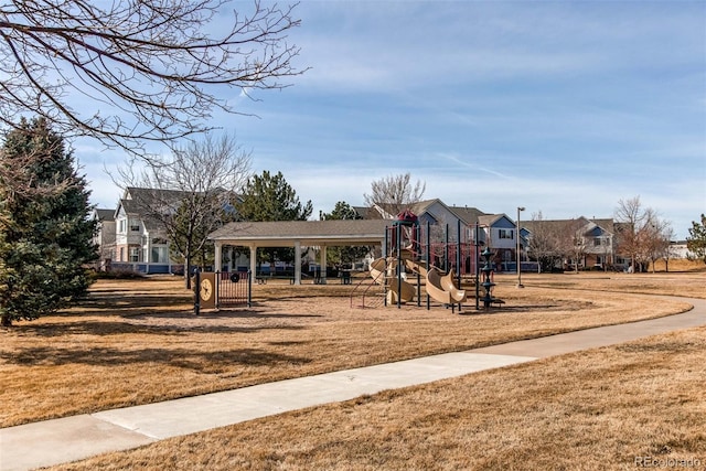 community play area with a lawn