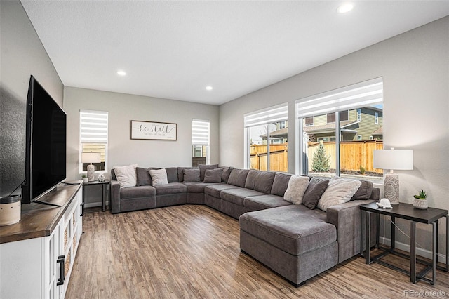 living room featuring recessed lighting and light wood finished floors
