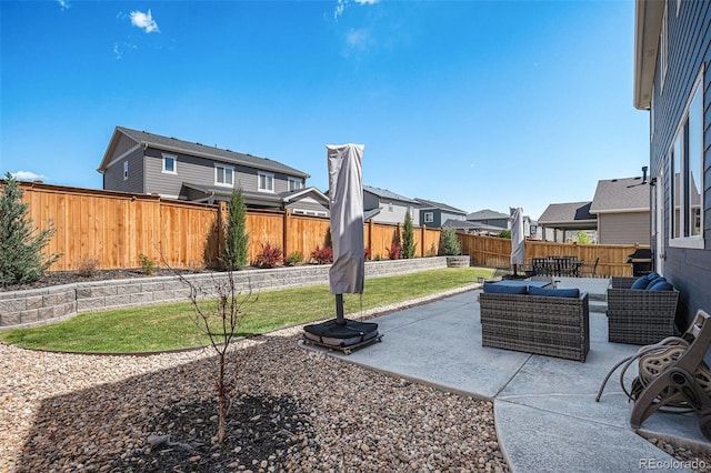 view of patio / terrace featuring a residential view, an outdoor hangout area, and a fenced backyard