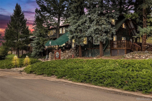 27425 Spruce Ln, Evergreen, CO 80439 - view of property hidden behind natural elements with a deck