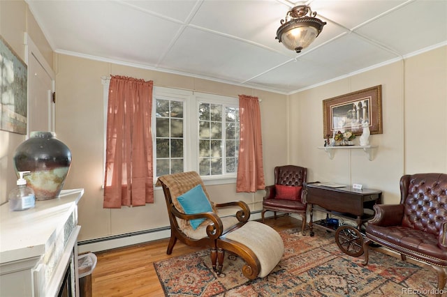 living area featuring baseboard heating and light hardwood / wood-style flooring