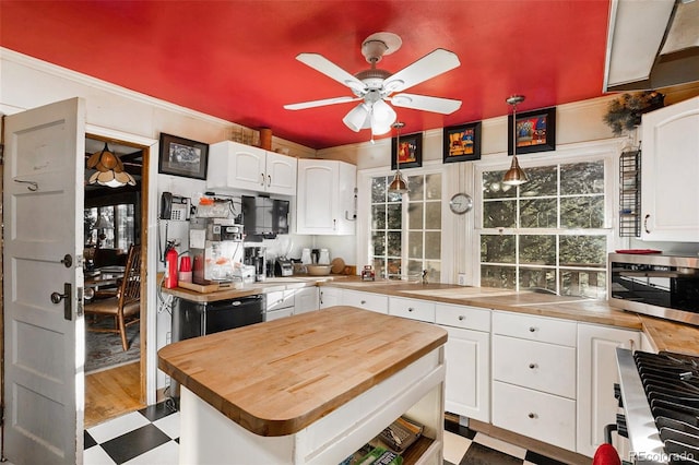 27425 Spruce Ln, Evergreen, CO 80439 - kitchen with butcher block countertops, stainless steel appliances, a ceiling fan, white cabinets, and crown molding