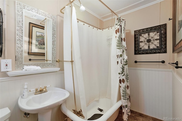 27425 Spruce Ln, Evergreen, CO 80439 - bathroom with crown molding, wainscoting, a shower with curtain, a sink, and toilet