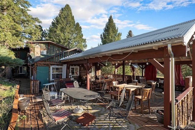 27425 Spruce Ln, Evergreen, CO 80439 - wooden deck with a gazebo and outdoor dining area