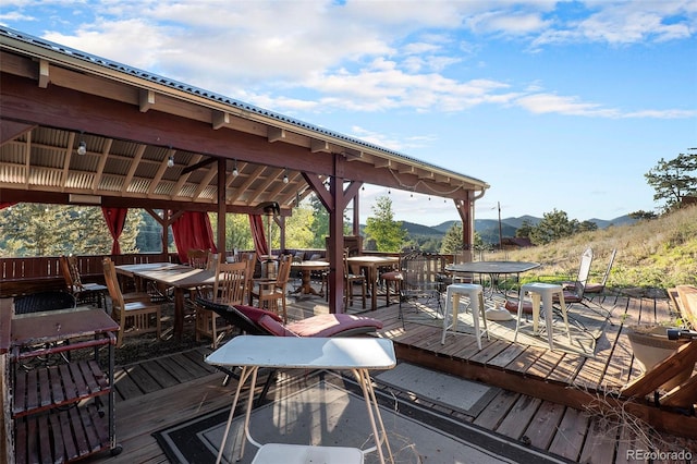 exterior space featuring a deck with mountain view