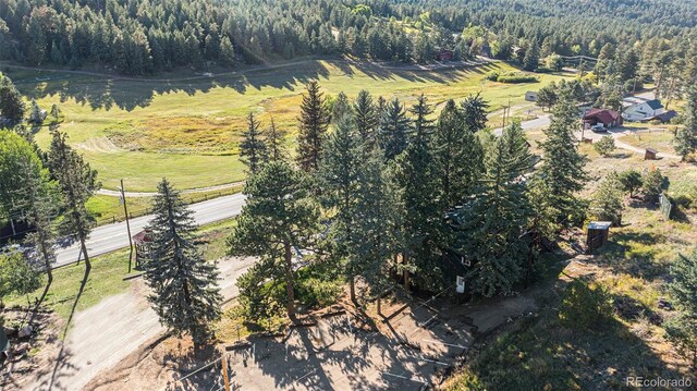 birds eye view of property with a rural view