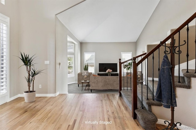 1328 Double Eagle Ct, Castle Rock, CO 80104 - foyer featuring stairs, wood finished floors, and high vaulted ceiling