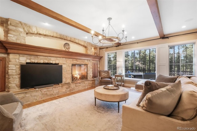 16092 Waving Branch Way, Colorado Springs, CO 80908 - living area featuring beam ceiling, a chandelier, wood finished floors, recessed lighting, and healthy amount of natural light
