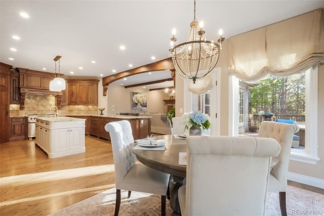 16092 Waving Branch Way, Colorado Springs, CO 80908 - dining space with light wood-type flooring, recessed lighting, a chandelier, and baseboards