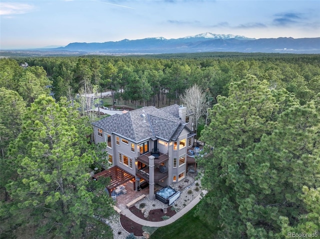 16092 Waving Branch Way, Colorado Springs, CO 80908 - view from above of property with a heavily wooded area and a mountain backdrop