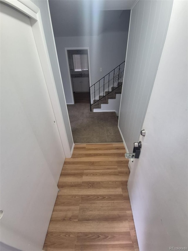 387 Tucson St, Aurora, CO 80011 - stairs with wood finished floors