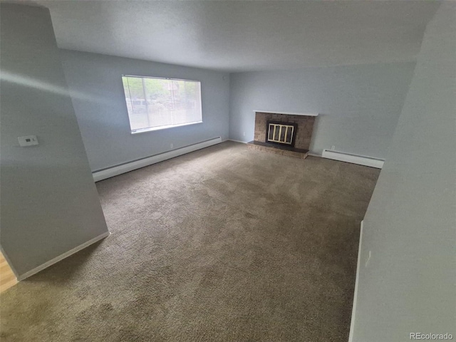 387 Tucson St, Aurora, CO 80011 - unfurnished living room with a baseboard heating unit, carpet flooring, and baseboards