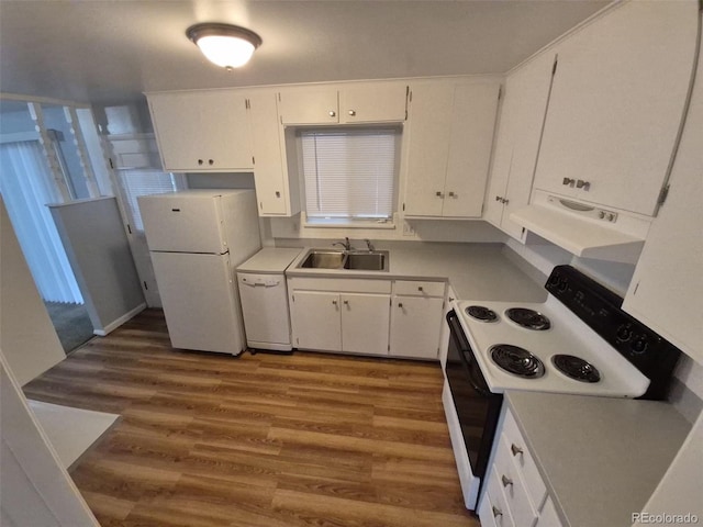387 Tucson St, Aurora, CO 80011 - kitchen with white appliances, a sink, wood finished floors, white cabinetry, and light countertops