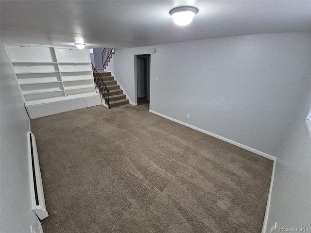 387 Tucson St, Aurora, CO 80011 - finished basement with carpet, stairway, and baseboards