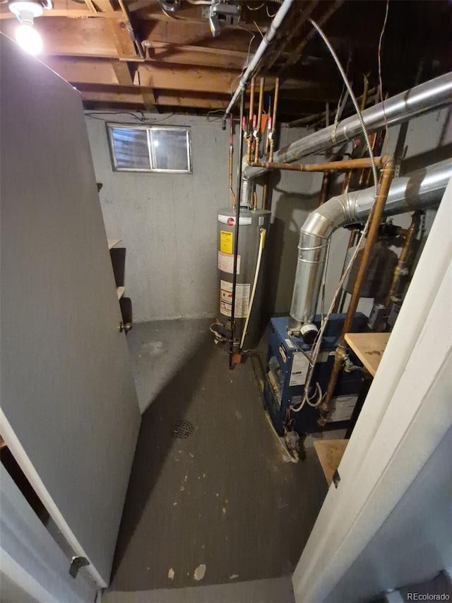 387 Tucson St, Aurora, CO 80011 - unfinished below grade area featuring water heater