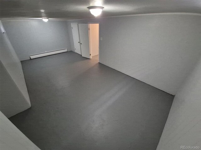 387 Tucson St, Aurora, CO 80011 - finished basement with a baseboard heating unit
