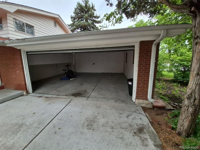 387 Tucson St, Aurora, CO 80011 - garage with concrete driveway