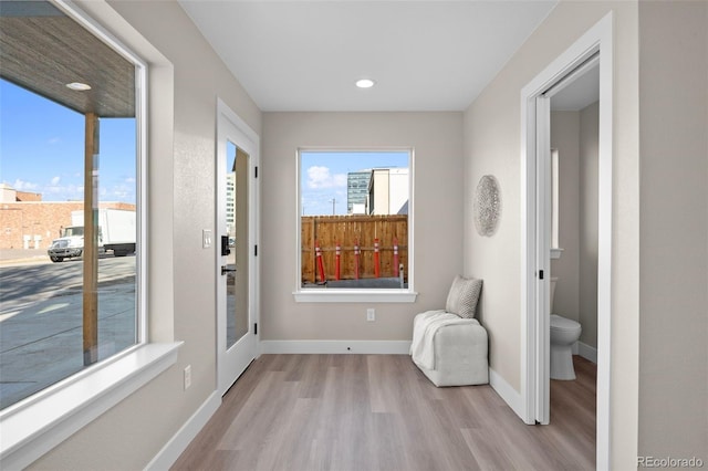 sitting room featuring recessed lighting, baseboards, and wood finished floors