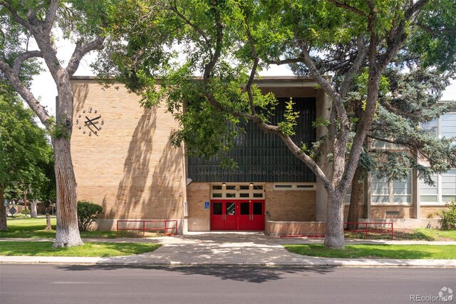 view of building exterior with concrete driveway