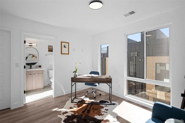 office with wood-type flooring