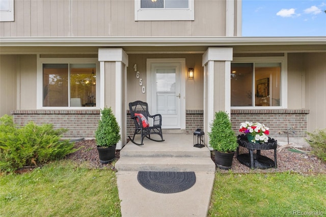 4650 S Idalia St, Aurora, CO 80015 - view of exterior entry with brick siding and a porch